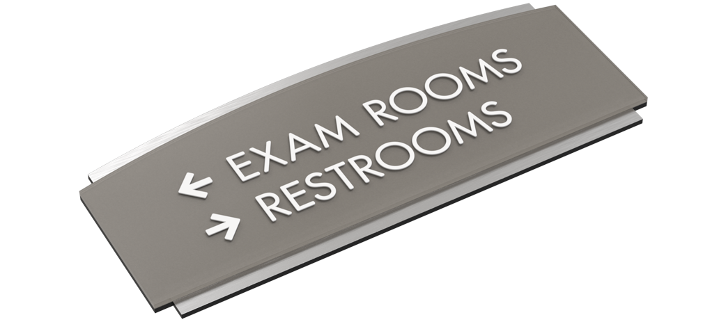 A room identification sign showing tactile text, braille, and a high-contrast room number.