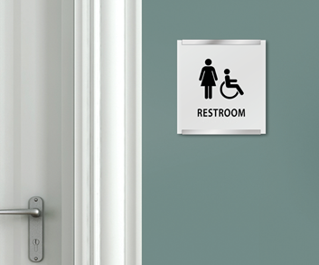 A women's ADA restroom sign with ISA wheelchair symbol