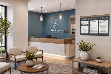 A doctor office waiting room with a customized Flexia Iso™ check-in sign, a message display board, and restroom directional sign near the reception desk.