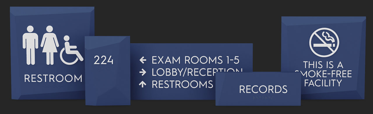 Restroom, room number, directional, common room, and informational Facets signs lined up in a row.