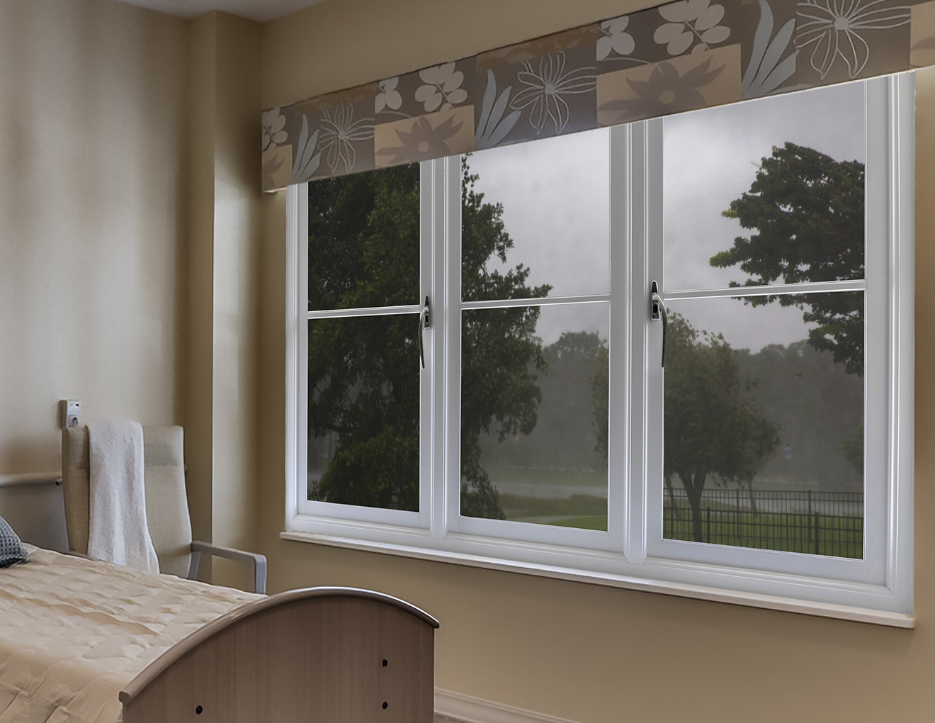 Patient Room in a senior care facility with a storm visible outside the window.